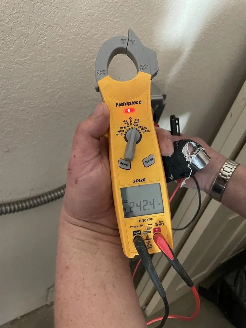 Voltage testing with clamp meter during Circuit Breaker Repair in Fraser
